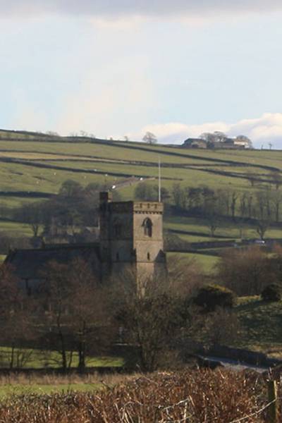 a church building surrounded by fields